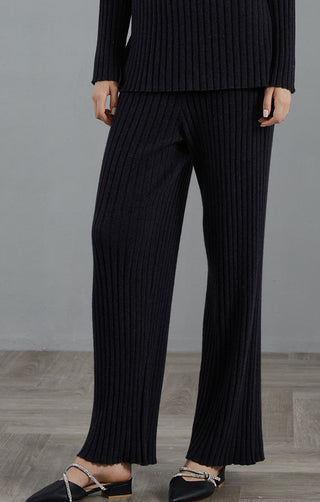Graphite gray cashmere ribbed knit pants, draped wide-leg fit with ribbed texture