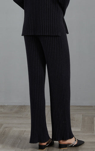Graphite gray cashmere ribbed knit pants, ankle-to-floor wide flare with ribbed hem
