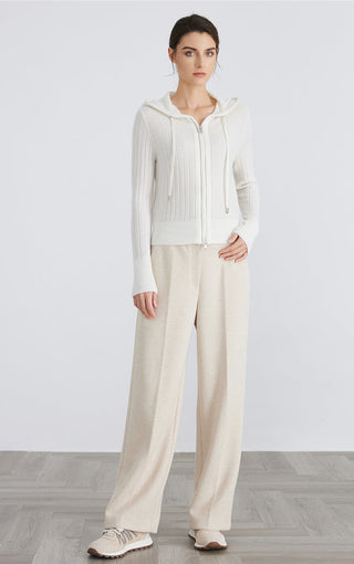 White hooded zip knit cardigan with ribbed texture, long sleeves and relaxed silhouette.