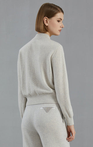 Light gray cashmere zip cardigan, back view with banded hem and zip closure