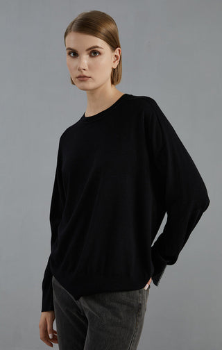 Black wool sweater with crew/round neckline and loose, flowing long sleeves