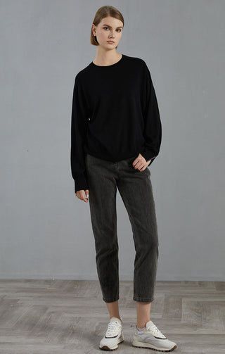 Black fine-knit wool round-neck sweater with loose fit and extended cuffs