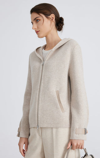 Camel wool knit hooded jacket, side profile; zip front and front patch pocket.