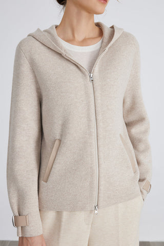 Camel wool knit hooded jacket close-up; center zipper, hood, and side pocket detail.