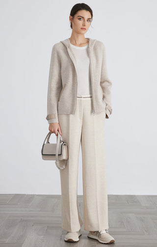 Camel wool knit hooded jacket, full look; zip front, button tab cuffs, and hood.
