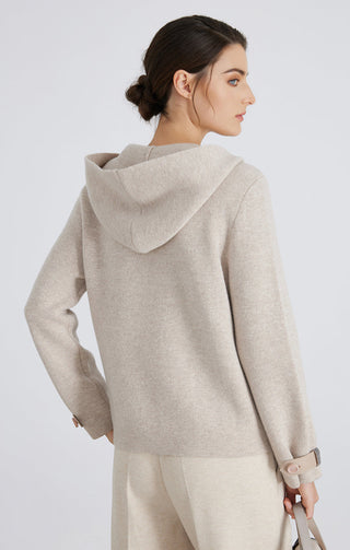 Camel wool knit hooded jacket, back view; draped hood with ribbed cuffs and hem.