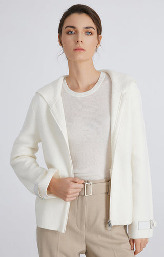 White wool knit hooded jacket, zipper front and ribbed cuffs; open hooded silhouette.