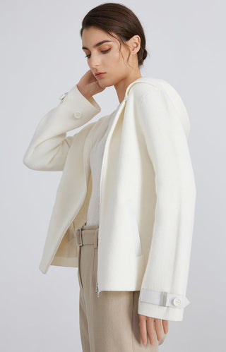 White wool knit hooded jacket, side view; zip front and buttoned cuffs with pockets.