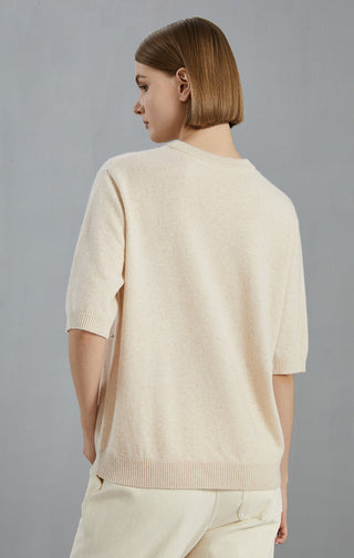 Beige cashmere sweater back view, smooth knit with embroidered dot accents