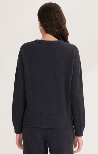 Black wool knit sweater back view with ribbed hem and long sleeves