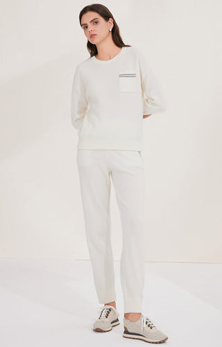 Cream wool knit sweater and pants set; chest pocket with dual stripe detail