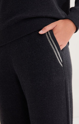 Black wool knit trousers detail: side stripe along leg seam