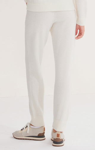 White wool knit trousers, back view with tapered leg and ankle cuff
