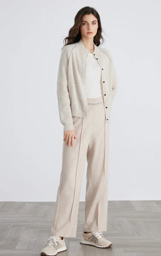 Beige button-front cardigan with V-stitch seams and hem-length knit profile