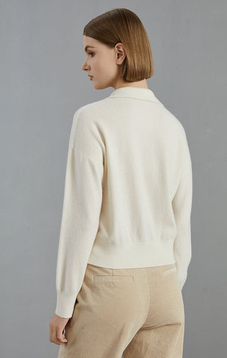 Back view of white cashmere half-zip sweater with ribbed waistband and curved hem