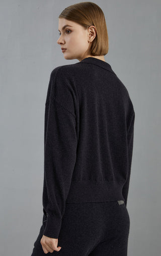 Back view of graphite gray cashmere half-zip sweater with ribbed waistband hem
