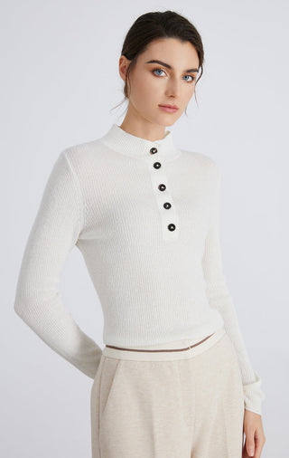 White mock neck button-up sweater, front/side view with long sleeves and button placket
