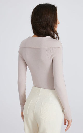 Back view: pale taupe ribbed knit sailor-neck top with contrast stripe detail