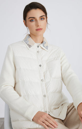 White knit-sleeve quilted down jacket with embroidered collar and button front, close view