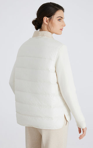 White quilted down puffer jacket from back with knit sleeves and rounded collar