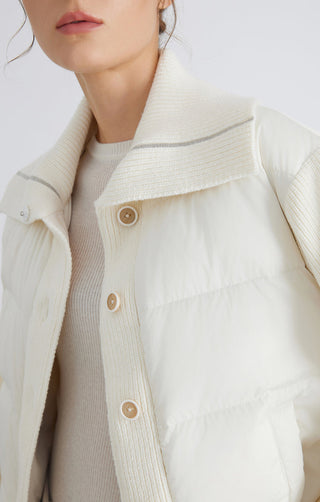 White knit-collar down jacket close-up with snap buttons and quilted front panel