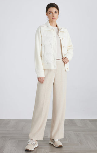 White hybrid down knit jacket with high collar and snap buttons, paired with trousers