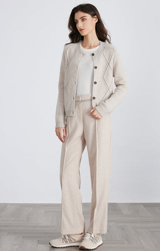 Light beige wool knit cardigan with diamond pattern panels and button placket.