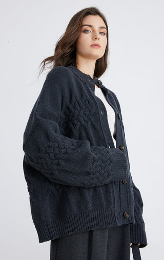 Dark blue cable-textured cardigan, long sleeves, button front, ribbed cuffs