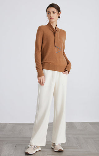 Brown cashmere V-neck pullover with tie neckline; long sleeves and relaxed fit