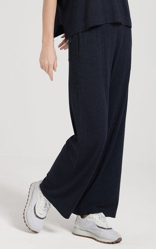 Dark navy wide straight-leg pants with side slit detail and straight, draped hem