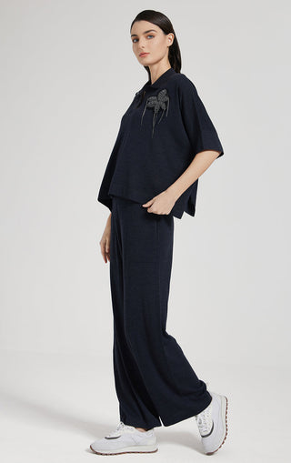 Dark navy straight-leg pants with wide leg silhouette and clean front seam line