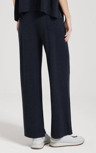 Dark navy straight-leg pants with back waistband seam and roomy, relaxed leg fit