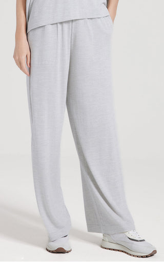 Light gray wool-silk straight-leg pants with long leg line and soft, relaxed drape