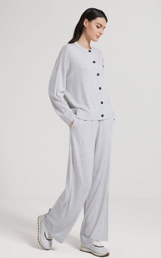 Light gray straight-leg pants with elastic waistband and relaxed fit through the leg