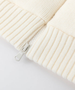 Ivory ribbed knit cuff with snap strap and zipper pull