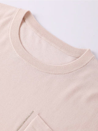 Light apricot crewneck sweater neckline, ribbed collar knit close-up