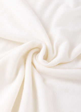 Off-white knit fabric close-up with fine woven texture