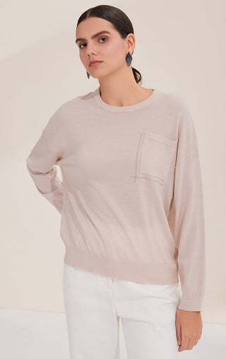 Light apricot crewneck sweater with silver bead-stitched lines and chest pocket panel