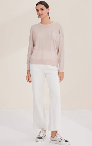 Light apricot wool crewneck sweater with pocket and silver bead line detail
