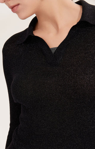 Black ribbed polo pullover close-up: V-neck collar with layered beaded neckline