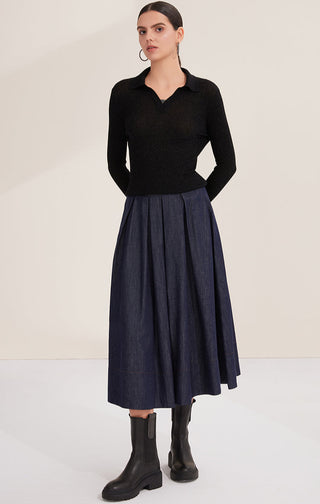 Black ribbed polo pullover, long sleeves and V-neck collar with layered beaded trim
