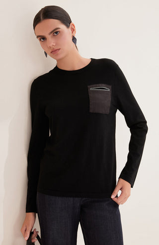 Black wool knit top with beaded pocket detail at chest, long sleeves, crew neck