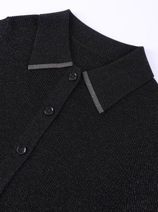 Detail view: black polo sweater collar trim and front buttons on ribbed fabric