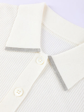 Detail view of white ribbed polo collar with button placket and trim