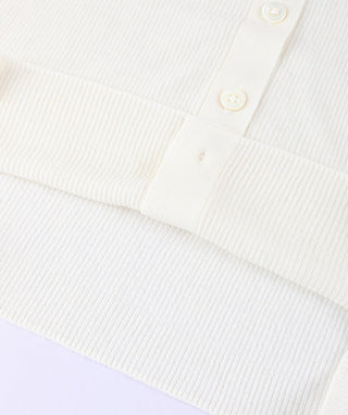 White ribbed sweater knit with button placket detail and straight neckline
