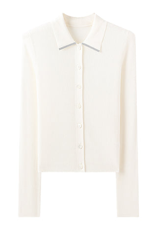 White ribbed button polo sweater laid flat, showing collar and front buttons
