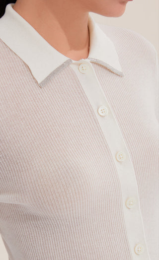 Close-up of white ribbed polo sweater placket with small front buttons