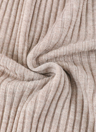 Light apricot wool blend knit fabric close-up with ribbed texture