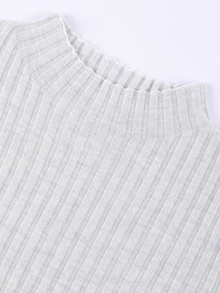Light apricot ribbed crewneck sweater neckline close-up with stretchy rib collar.