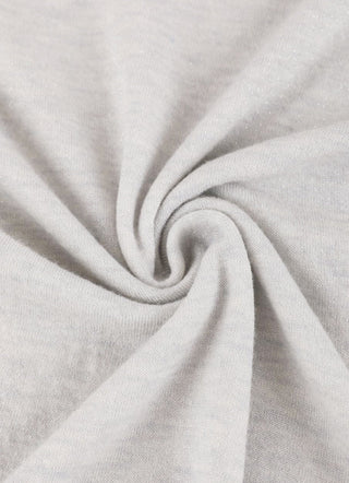 Close-up of soft knit texture on light heather long-sleeve sheer top.